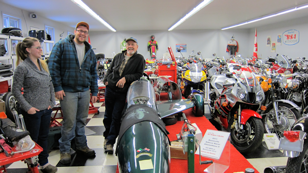 Bar Hodgson shows his guests some of his collection of motorcycles